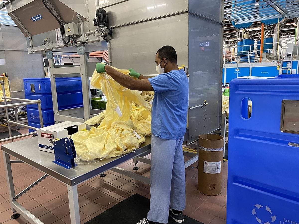 Staff member sorting clothing